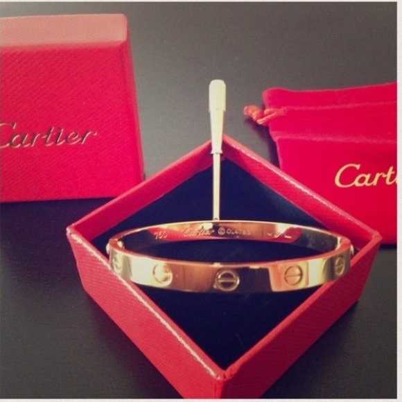 Gold tone screw bangle bracelet