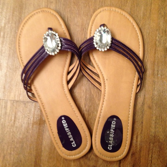 Purple rhinestone flip flops