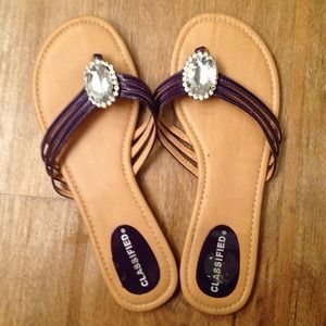Purple rhinestone flip flops
