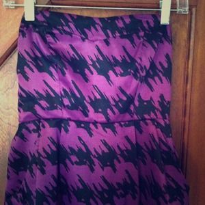 A beautiful purple and black cocktail dress.