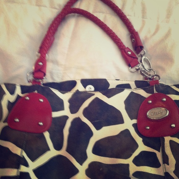 Giraffe with red piping purse