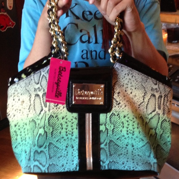 Betseyville gold snakin around bag.