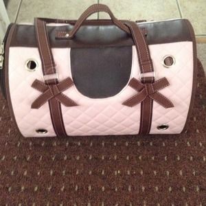 A cat carrier. Can also be used for small dogs.