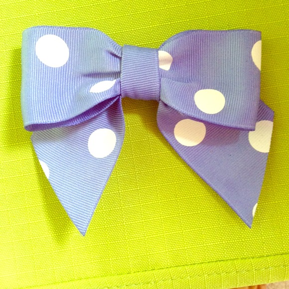 Blue with white polka dot bow.