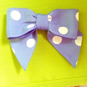 Blue with white polka dot bow.
