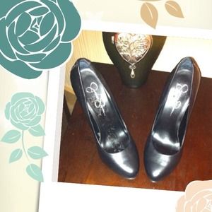 Black platform heel has a cool braided heel detail