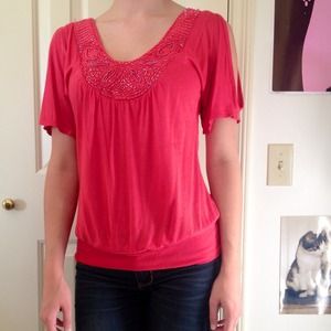 Coral top with beading.