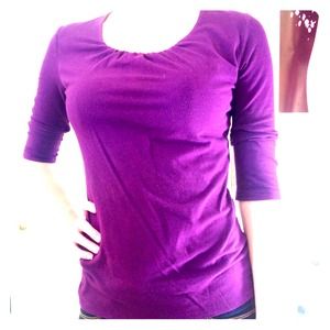 Purple scoop neck shirt.