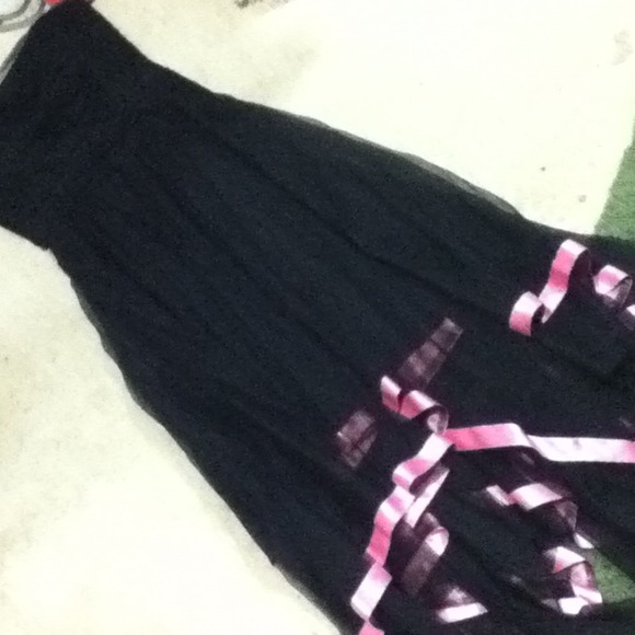 Black party dress with pink trim along the bottom