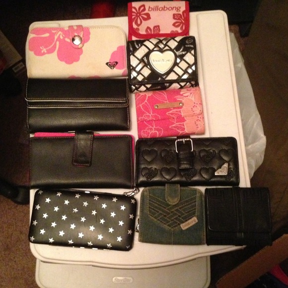 Bundle of 11 wallets and 4 make up bags