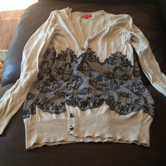Ivory cardigan with black lace pattern