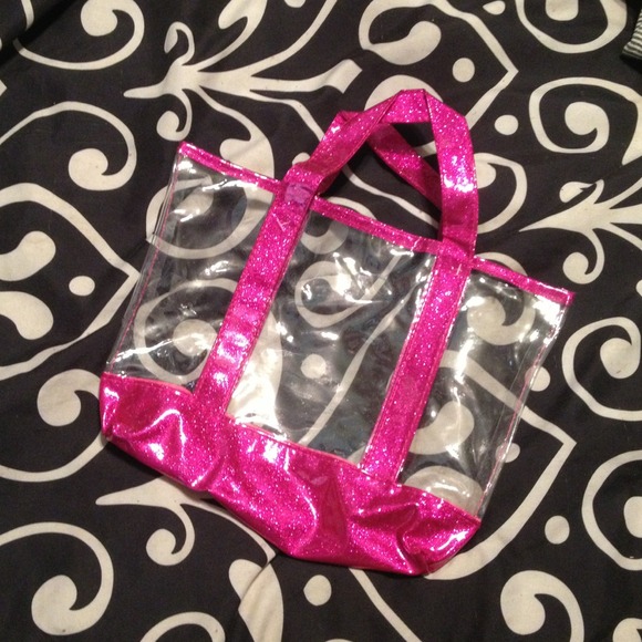 Clear, plastic purse trimmed in pink glitter