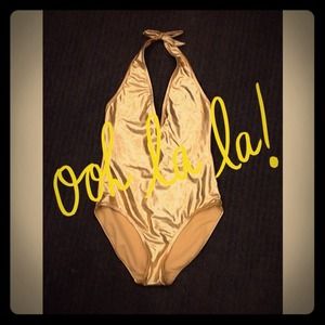 Gold member one piece bathing suit never worn
