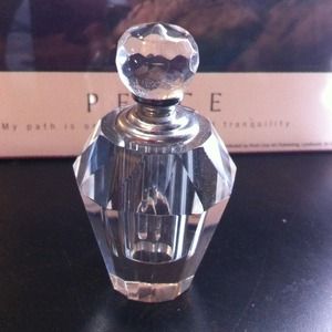 Decorative glass bottle with top