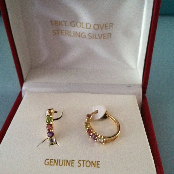 18 KT gold and sterling silver.