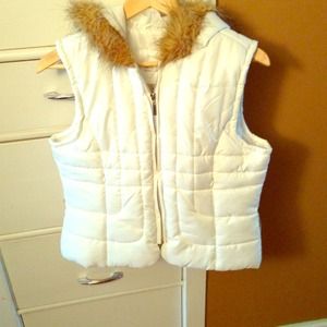 Puffy white vest with faux fur hood