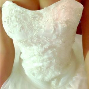 Beautiful wedding gown, never worn before.