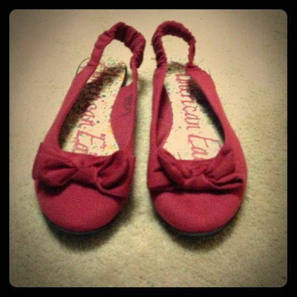 Red slip on sandals with bow