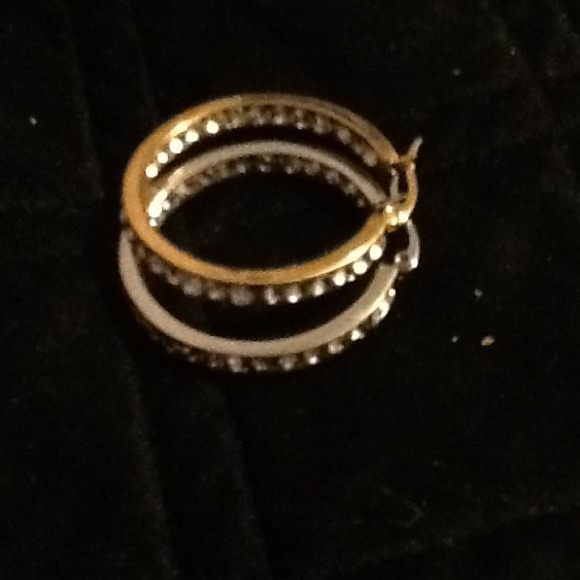 Gold pair and silver pair of earrings
