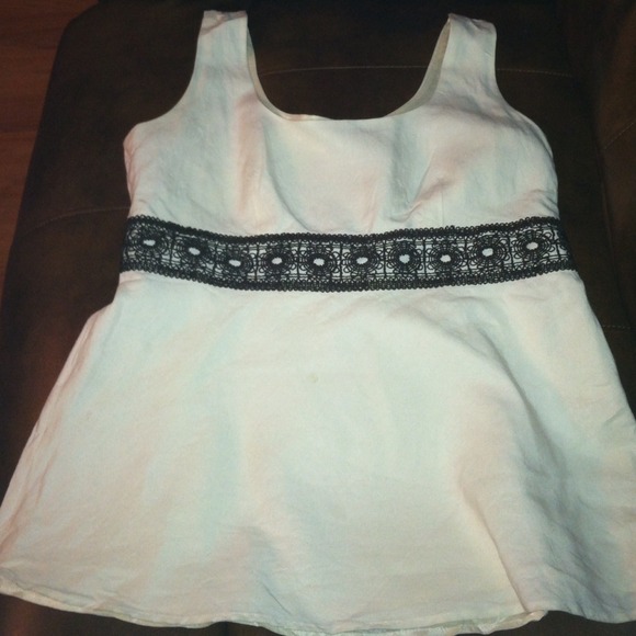 Cream sleeveless w/ brown decrotive trim