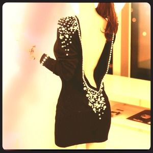 Backless black dress with pearls