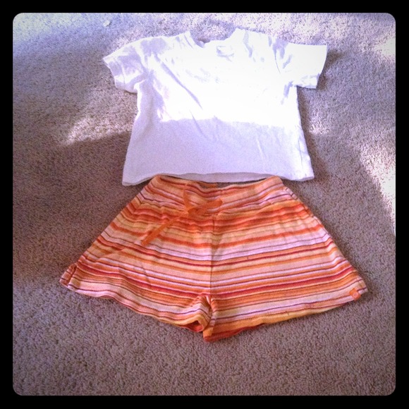 T-shirt, and orange shorts.