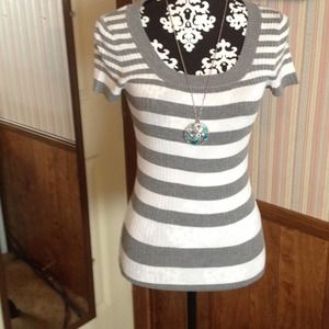 White and gray striped , short sleeve shirt.