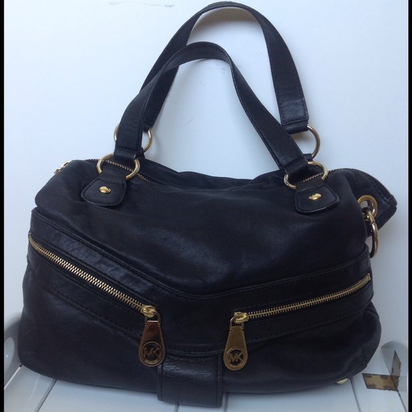 Michael Kors black leather purse w/ golden O rings
