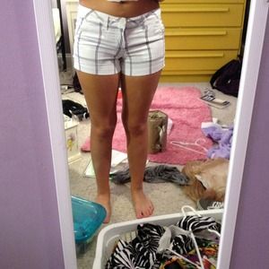 White shorts with purple and gray lines