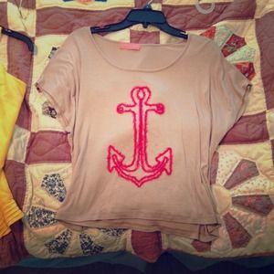 beige crop top with red anchor