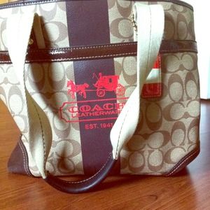 **HOLDING** Authentic Coach bag *nice size* !!