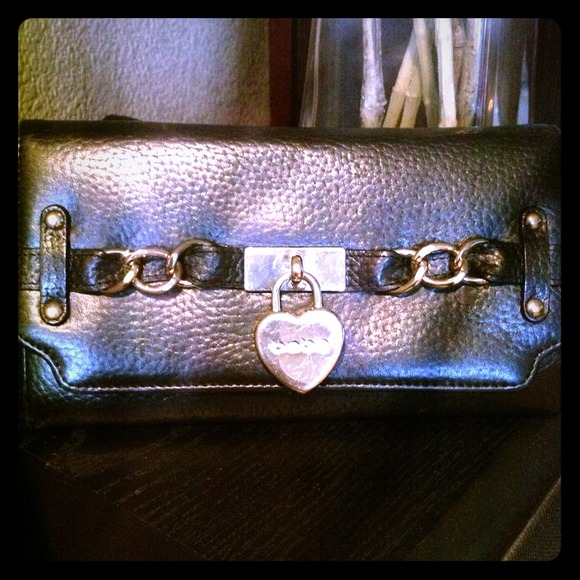 PRE owned black leather BeBe wallet with gold.