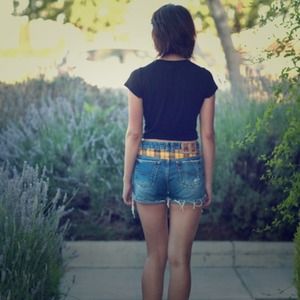 Distressed denim shorts with plaid back.