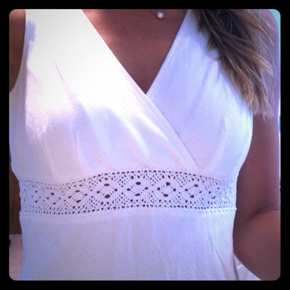White medium length dress with crochet band