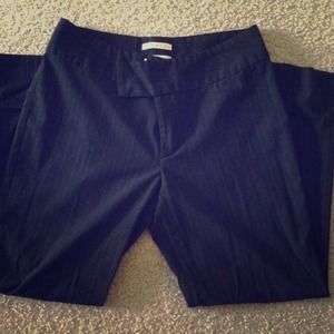 Black pinstripe dress pants. Ankle length.