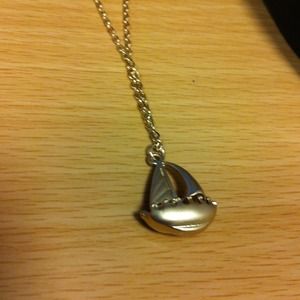 Gold tone boat necklace