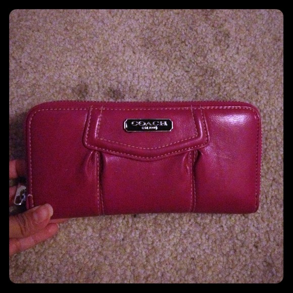Pink coach clutch