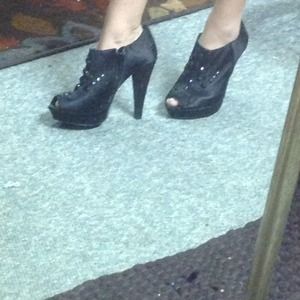 Black studded peep toed pumps