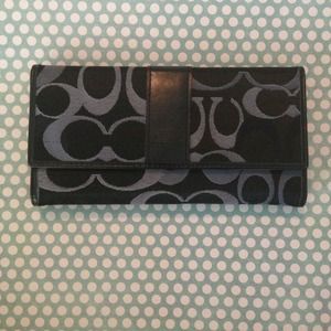 Authentic Coach leather wallet. Navy and black.