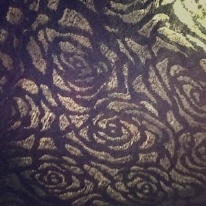 Cute black top. Front sheer with floral design