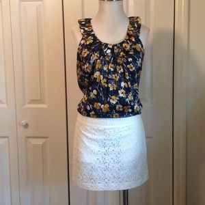 Navy floral print top with ruffled scoop neck