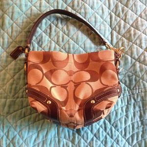 New with tags!!! Black and tan Coach purse