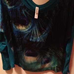 Turquoise feather shirt.