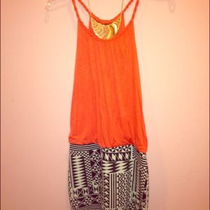 fitted skirt attached to a vibrant orange blouse!