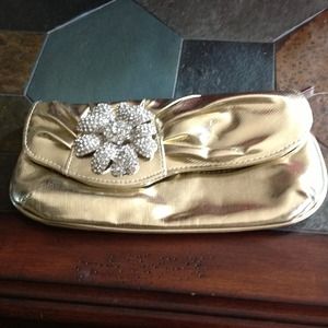 Gold clutch with brooch