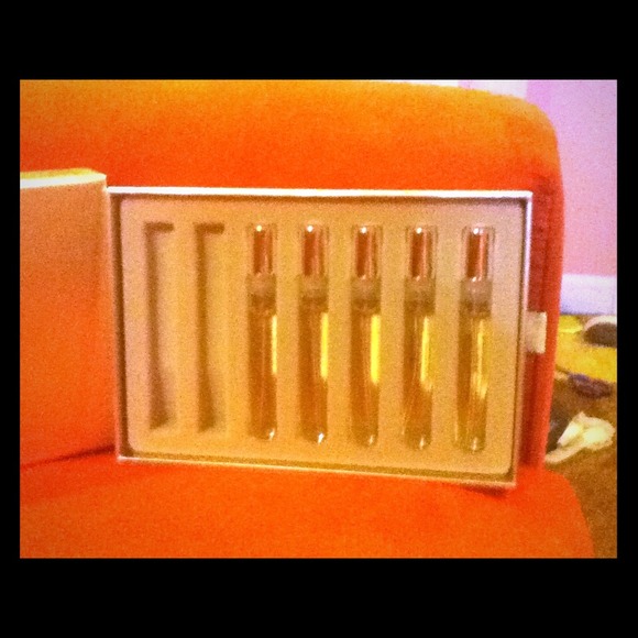 5 travel or purse bottles of CASHMERE MIST!!!