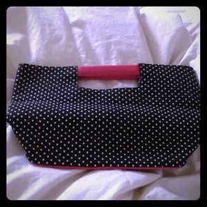 Black purse with white Polka dots and pink trim