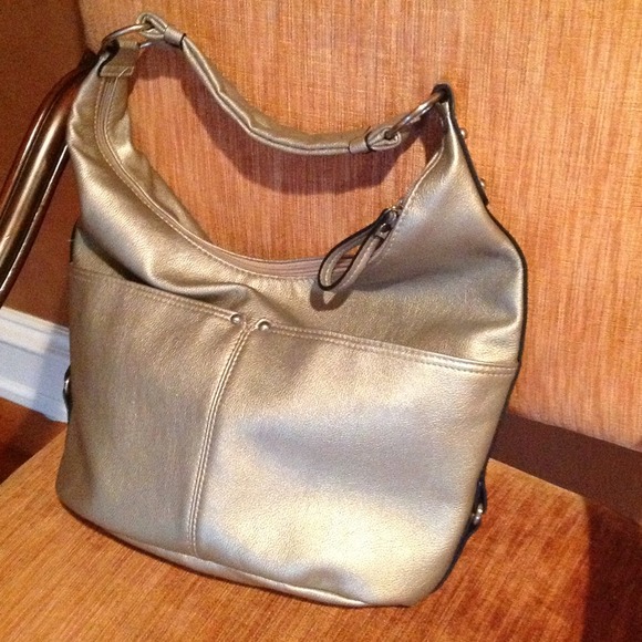 Medium sized cream metallic handbag