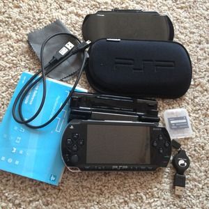 PSP with memory card, charger/stand, case