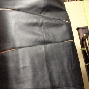 Stunning leather skirt has some cut outs.